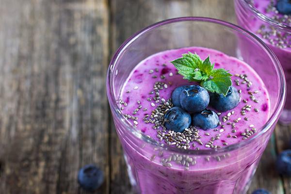 Close up of a blueberry smoothie with chia seeds.