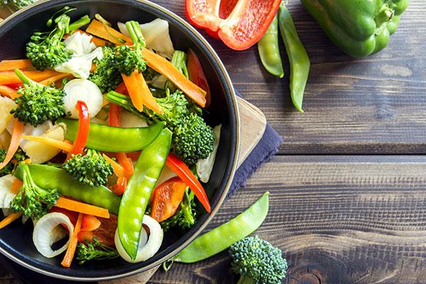 A bowl of stir fried vegetables.