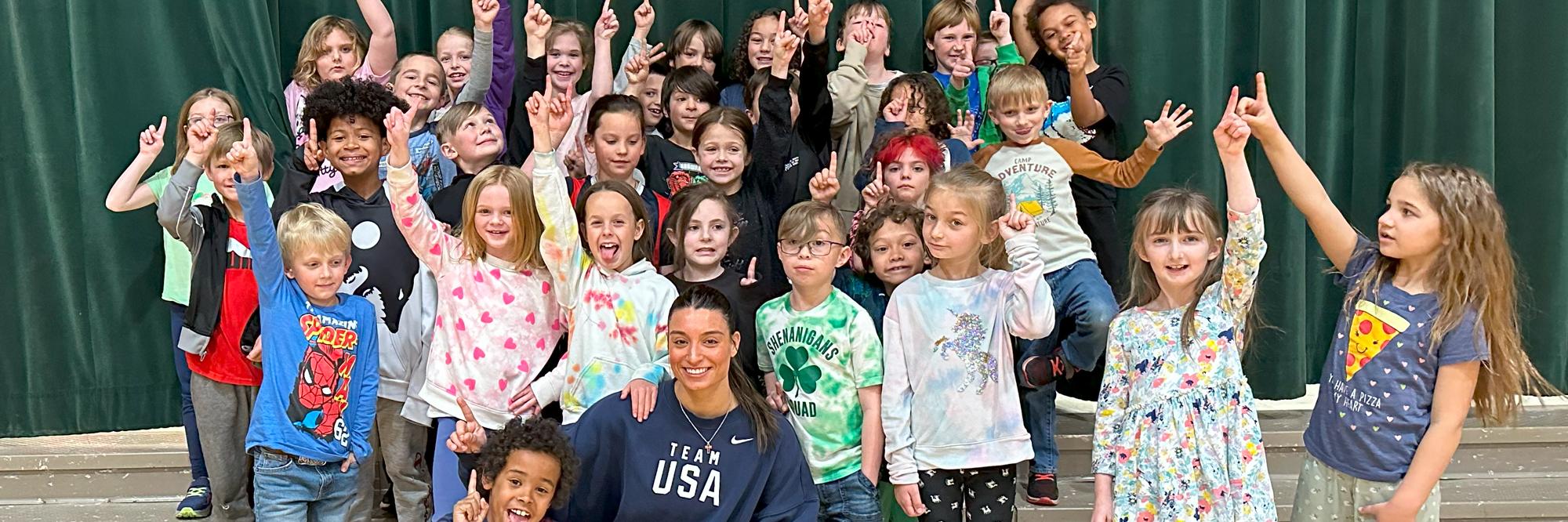 Ambassador Abby Raymond with an elementary school group.