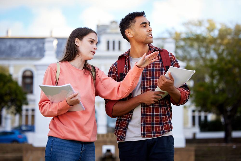 A potential college student touring a campus with a student guide.