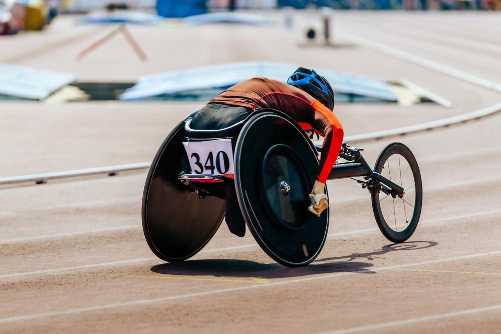 Woman handcycling on track.