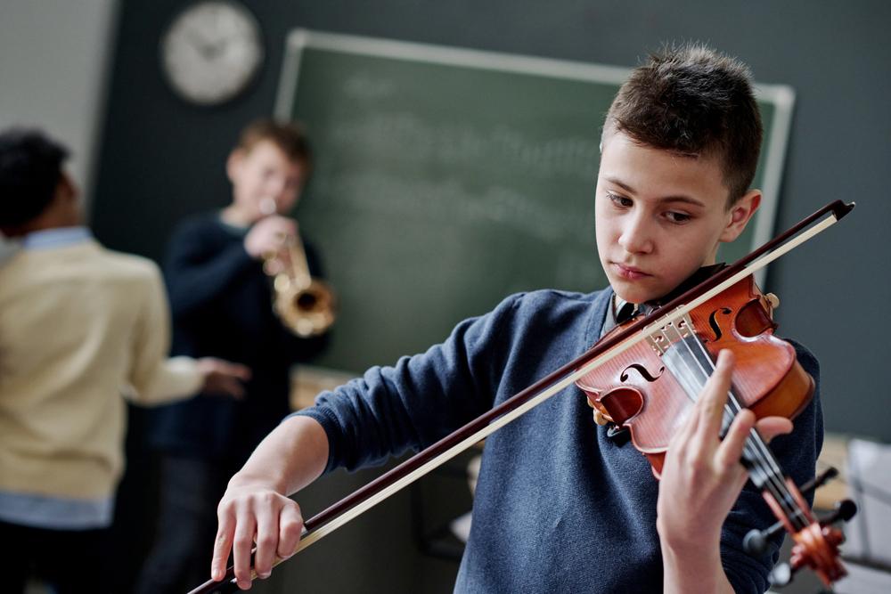 Young man playing a violin.