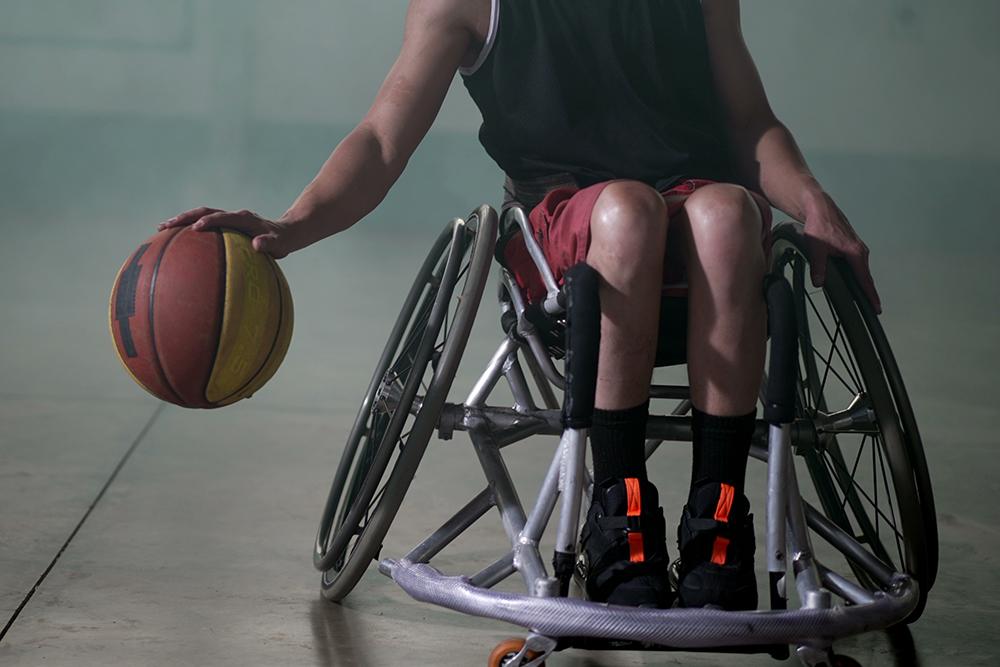 Close up of wheelchair basketball player.