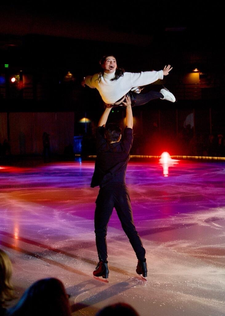 Luke Wang lifting Olivia Flores during Figure Skating routine.