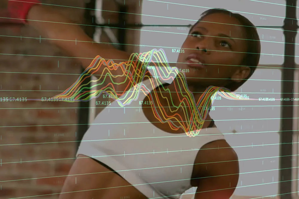 A young woman lifting weights with an overlay of a graph of data.