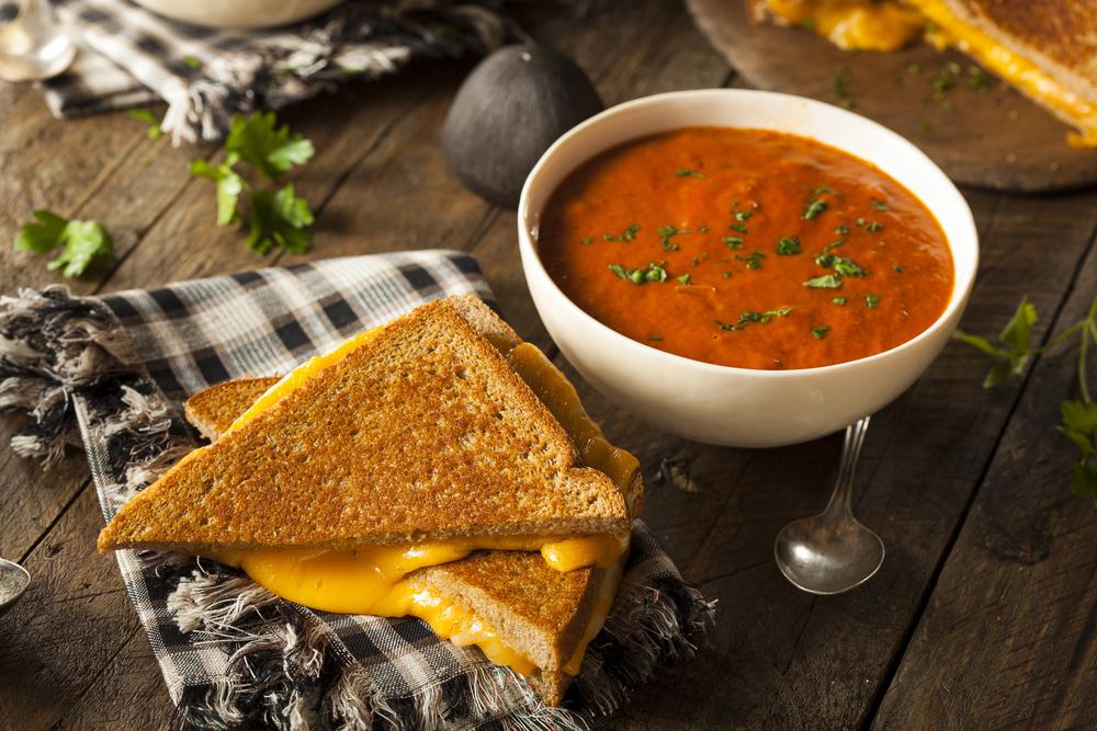 Grilled cheese and a bowl of tomato soup.