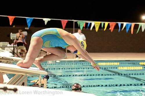 Girl with missing limb swimming in competition.