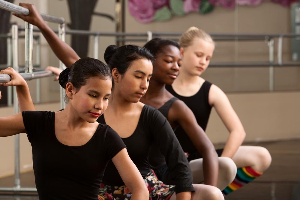 Diverse group of female ballet dancers.