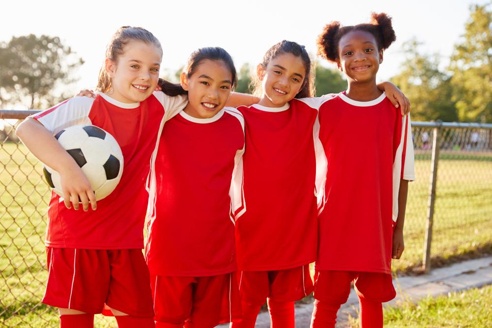 Young, diverse female soccer team.