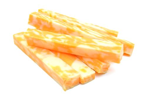 Colby cheese sticks isolated.