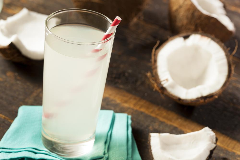 Coconut water with straw.