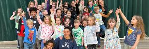 Ambassador Abby Raymond with an elementary school group.