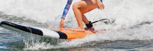 Young girl surfing.