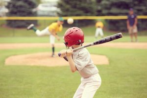 Young boy at bat during baseball game.
