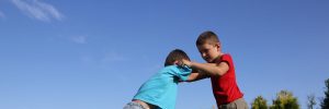 two young boys fighting.