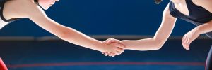 two young wrestlers shaking hands