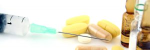 Syringe, pills, and supplements.