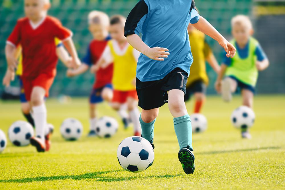 Young kids practicing soccer.