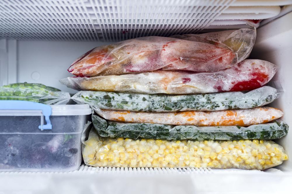 Meals in bags in a freezer.