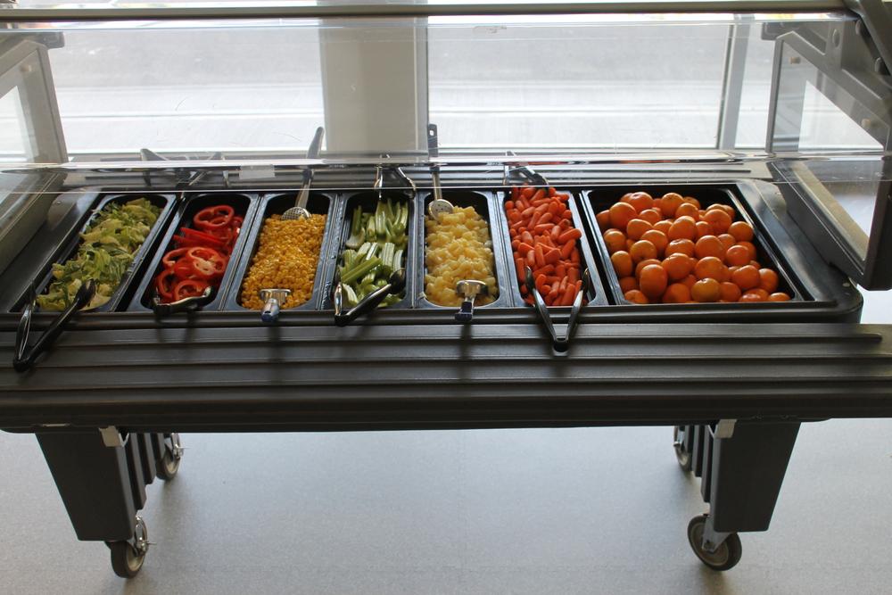 Vegetables and fruit in a school cafeteria.