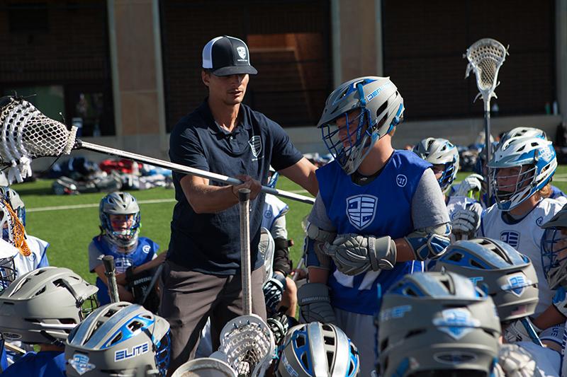 Trevor Tierney coaching his lacrosse team.