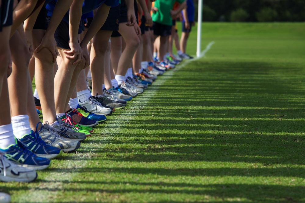 Kids lined up in grass to begin race.