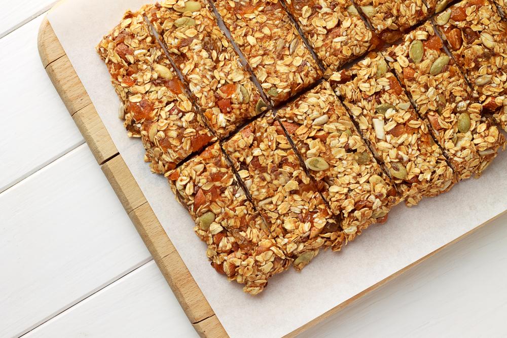 Homemade granola bars on a sheet.