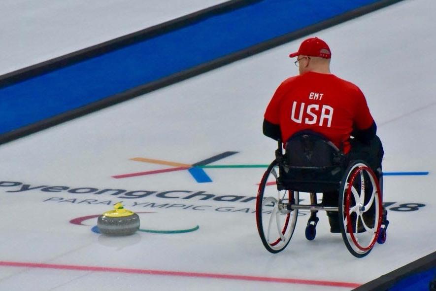 Paralympian Steve Emt on the ice for a curling game.