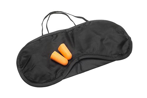 A sleep mask and ear plugs.