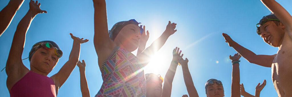 swimmers raising hands