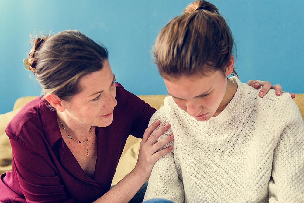 Mother concerned and talking to daughter.